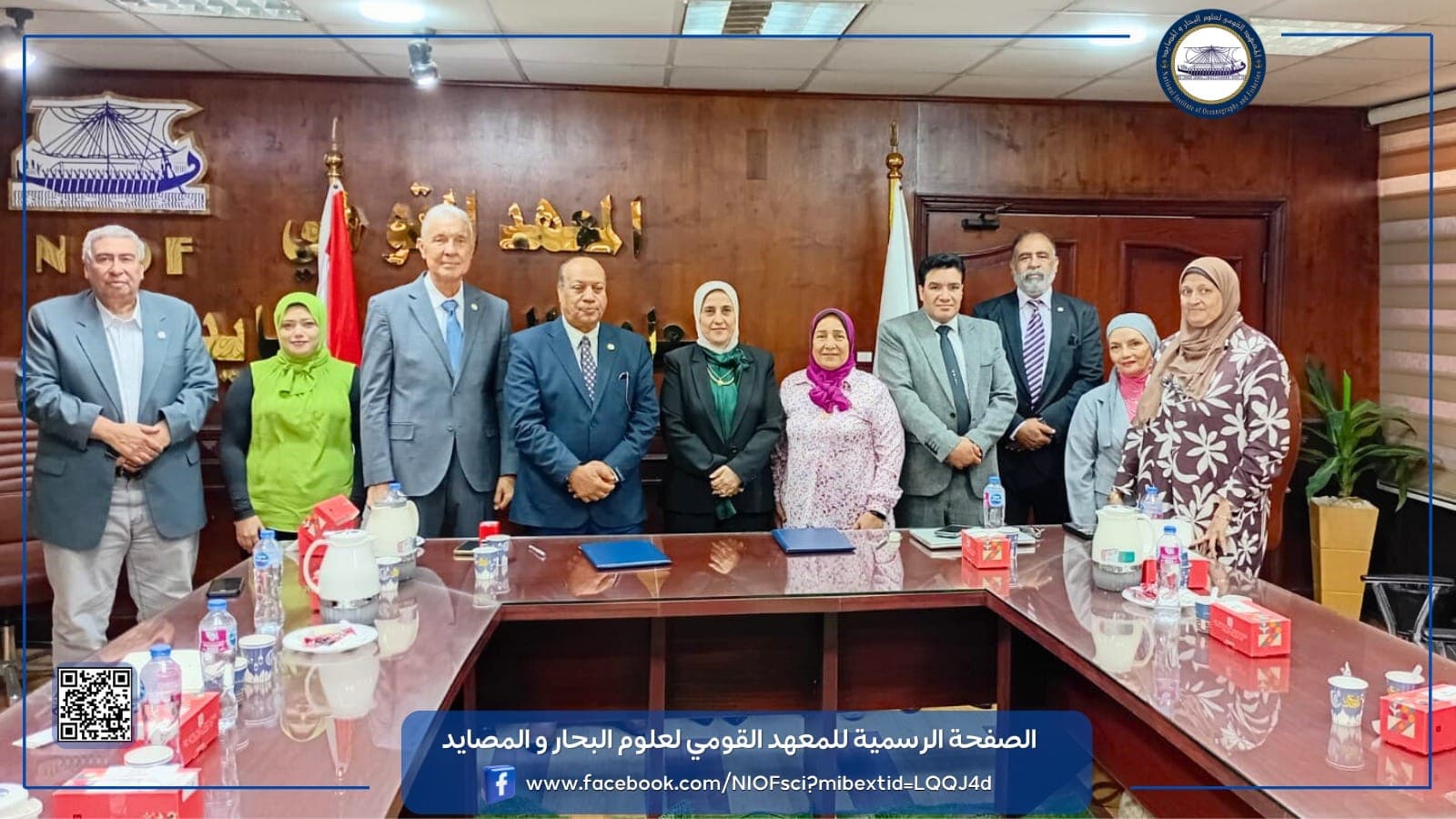 An electric vehicle charging in front of modern buildings.